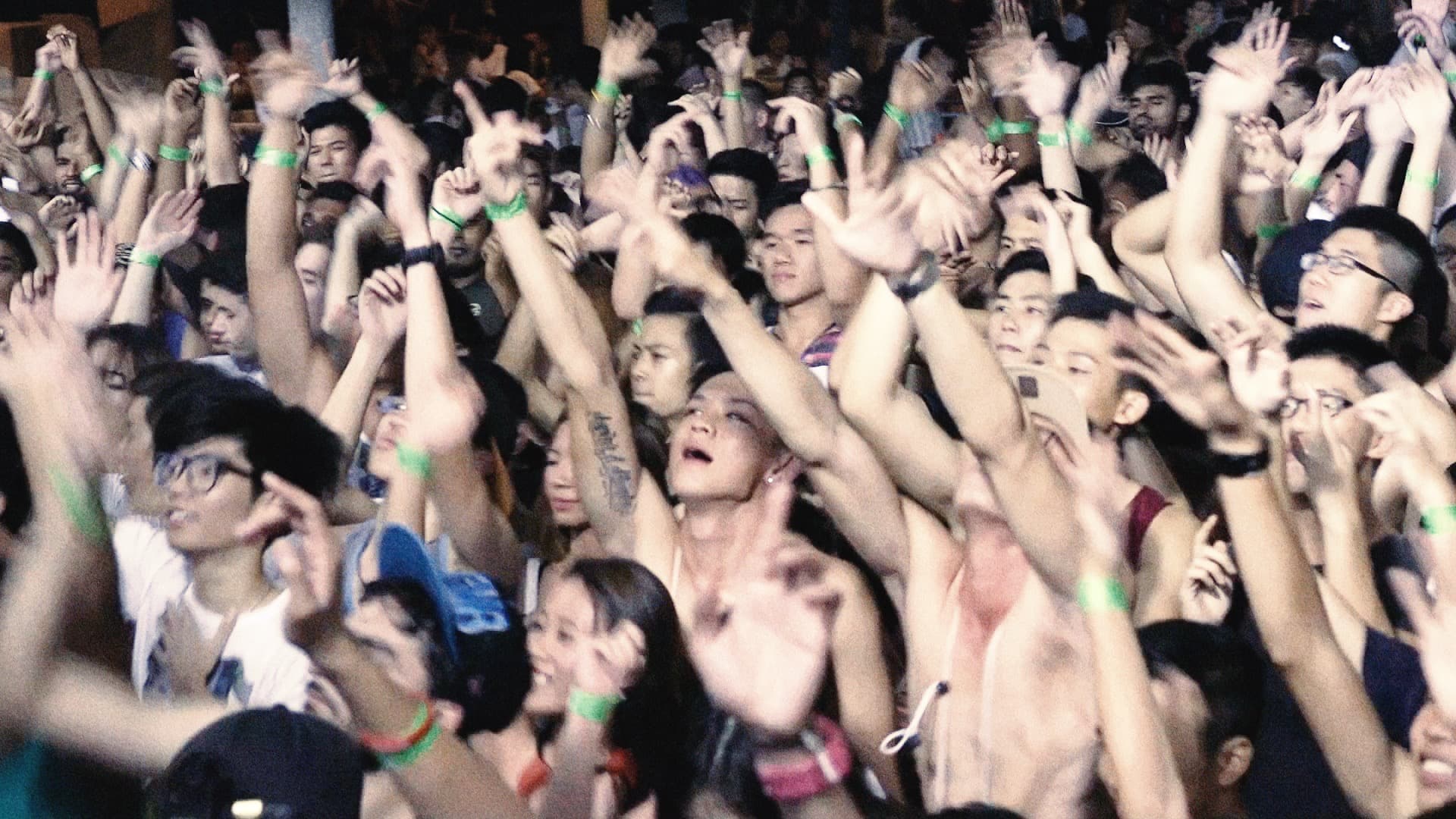 Raised hands at a public gathering in SEMENTARA.